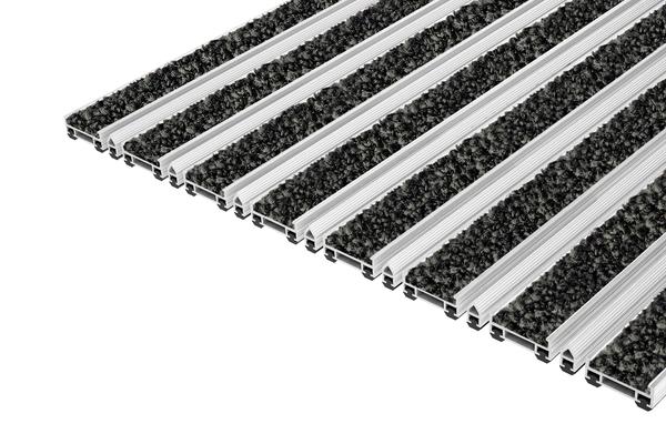 Top Clean TREND PULSE: I tappeti d'ingresso Top Clean TREND PULSE con inserto PULSE, realizzati al 100% in poliammide, sono adatti per un normale uso interno. 